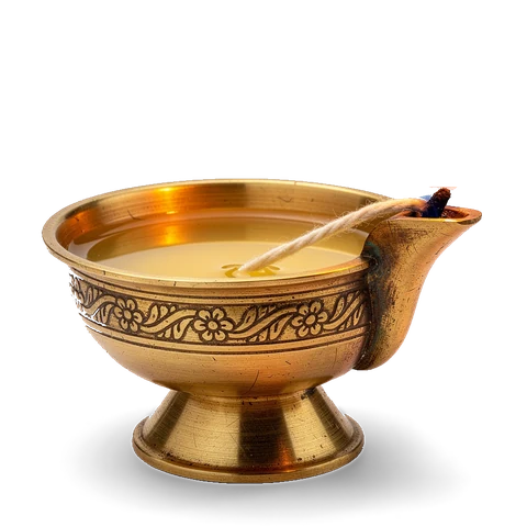 A brass diya burning with a steady flame